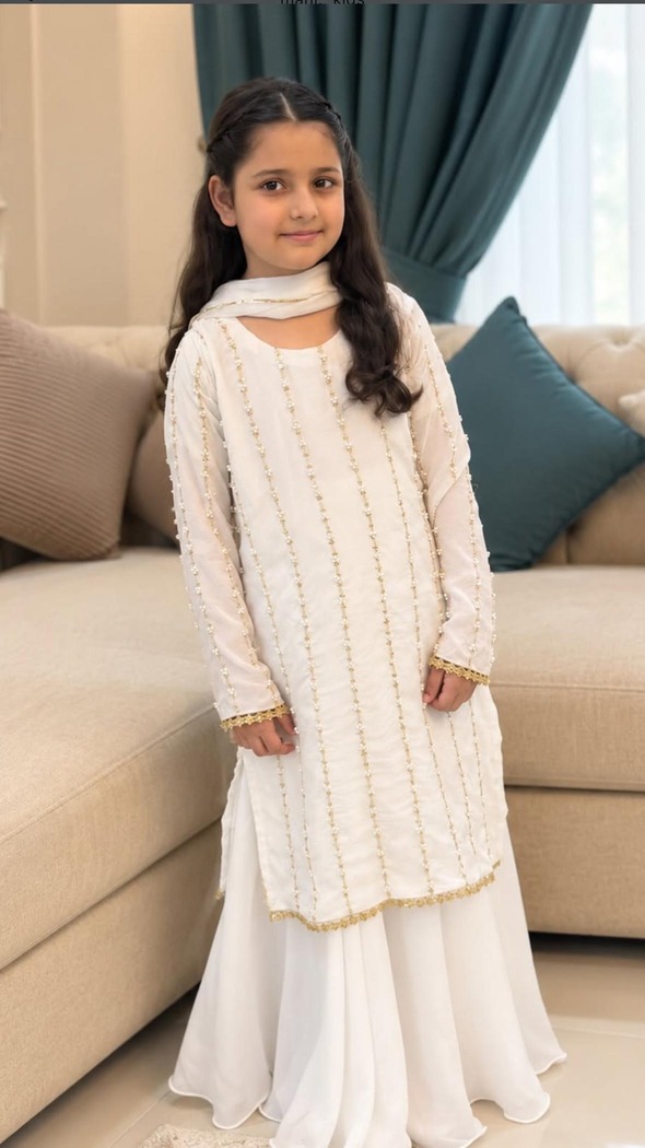 Girl in ivory raw silk Noor outfit